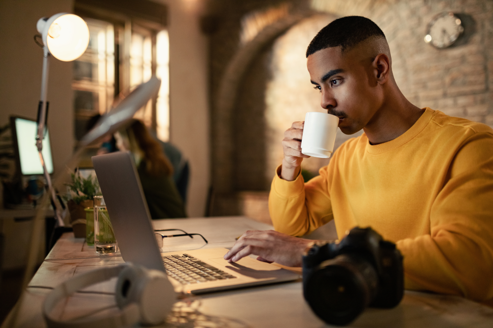 Professional reading and working on a laptop